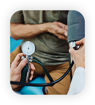 Close up of doctor measuring blood pressure of an elderly patient.